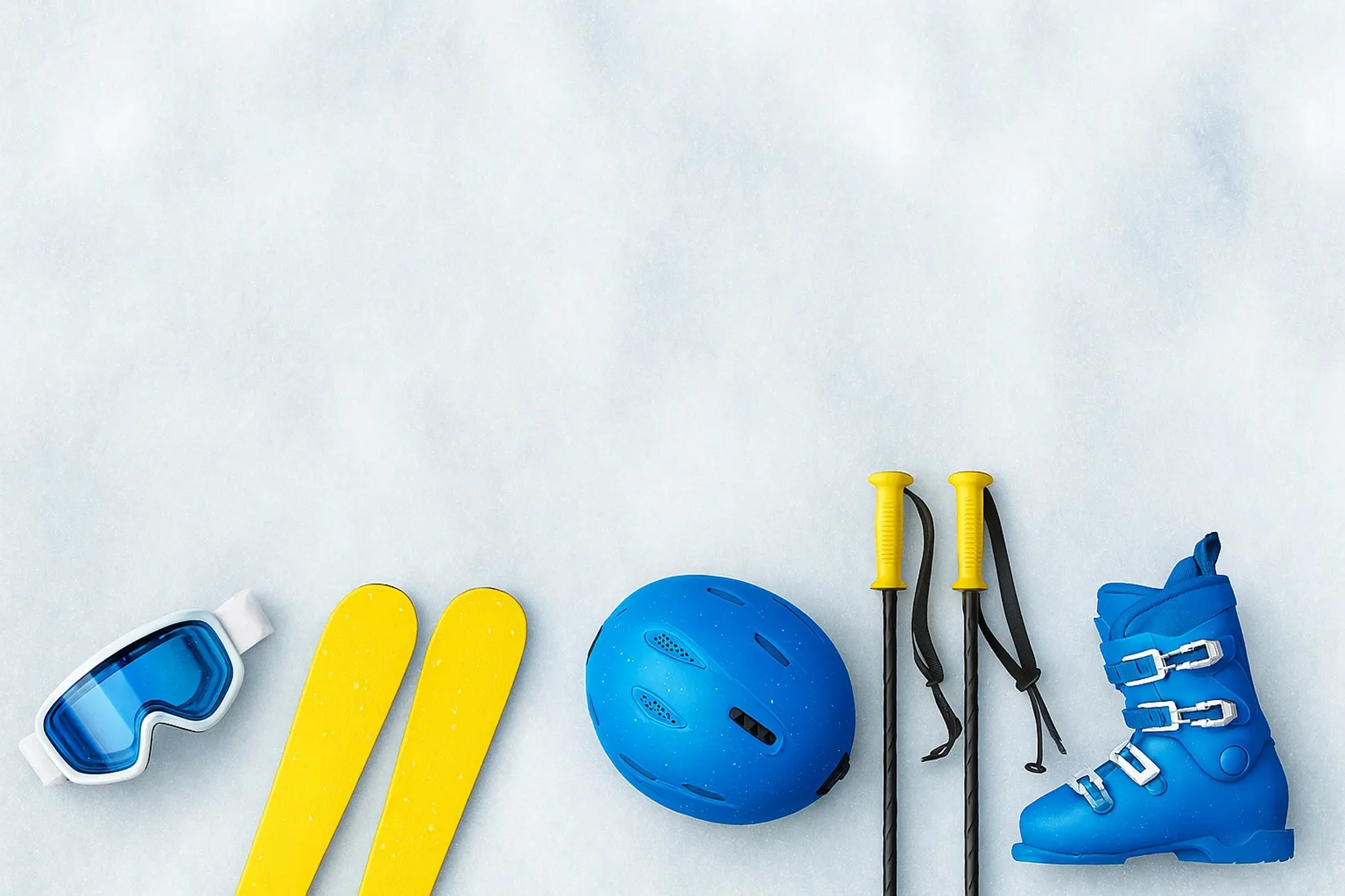 Equipación de esquí con los colores corporativos de ILUNION sobre la nieve